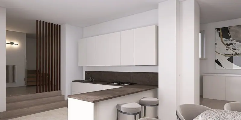 Cucina bianca con penisola e piano scuro